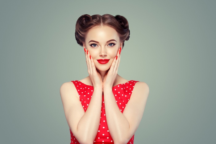 Woman with retro hairstyle and red polka dot dress