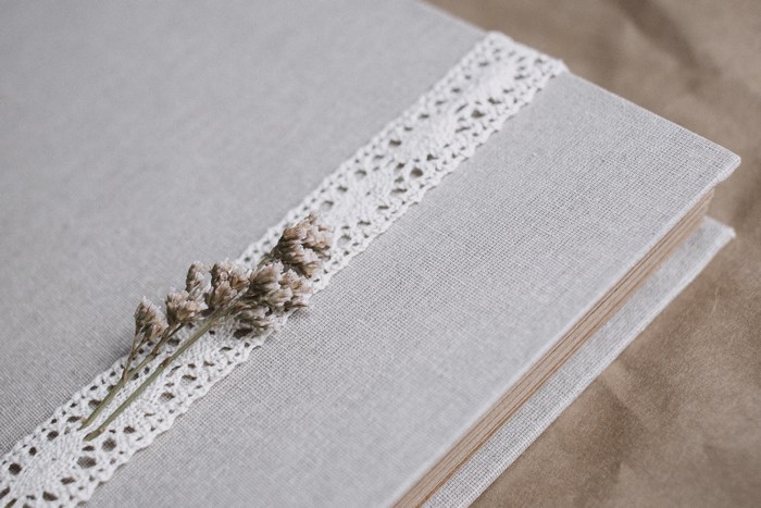 Linen book with lace and dried flowers