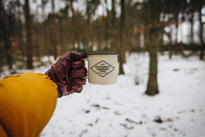 Gentlemen's Hardware mug in a snowy forest