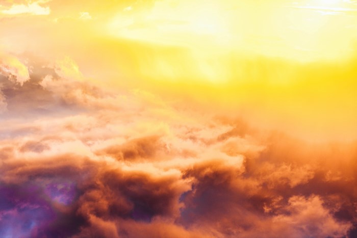 Dramatic sky with orange and purple clouds at sunset