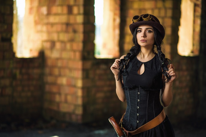 Steampunk woman with braids and goggles