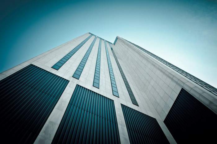 Modern Skyscraper with Blue Windows and Clear Sky
