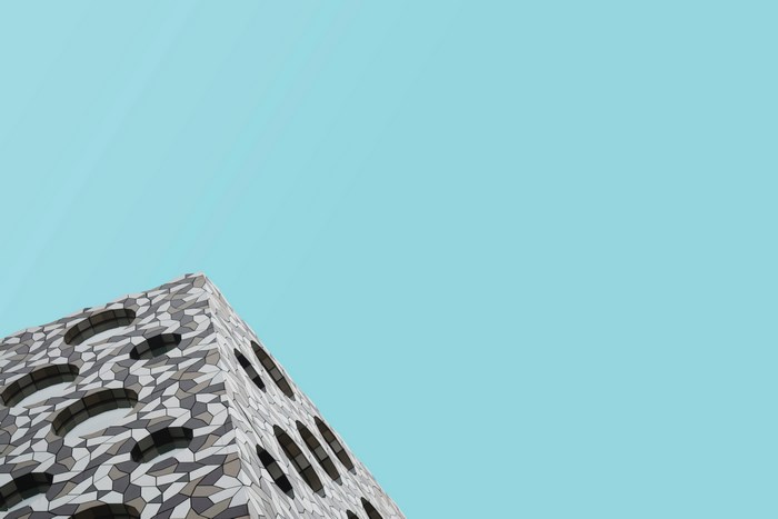 Ravensbourne University building with patterned facade and circular windows