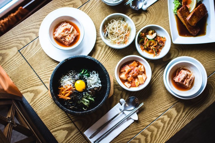 Korean food spread with bibimbap and salmon