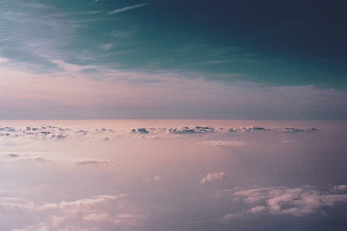 Above the clouds, horizon, and sky