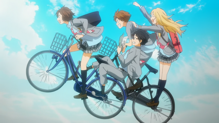 Four friends riding a bicycle together
