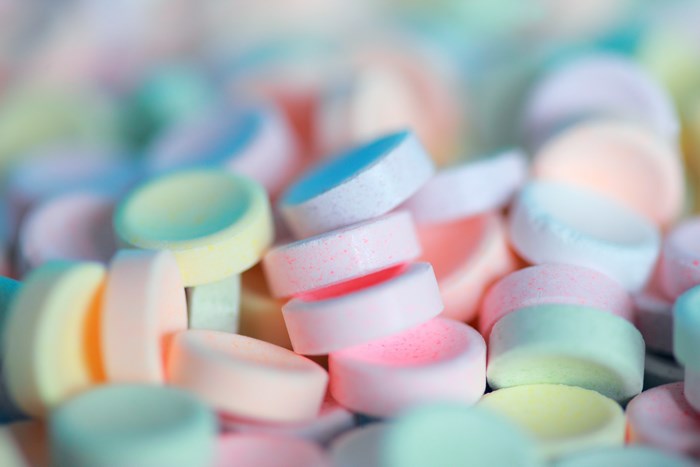 Close up of pastel colored candy discs