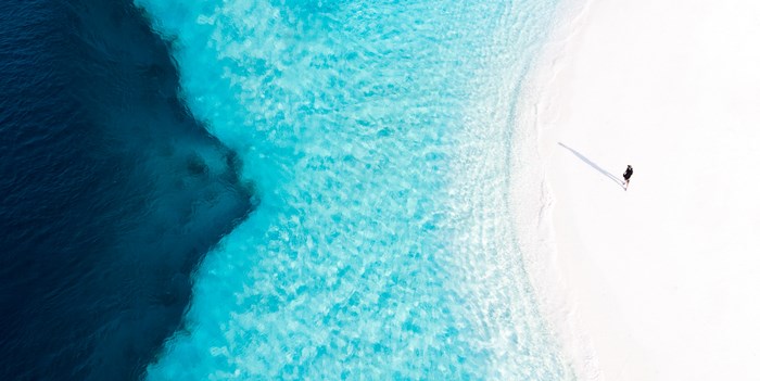 Solitary Person Standing on Pristine Maalhos Beach
