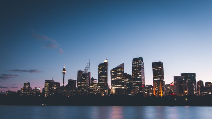 Sydney skyline at dusk with waterfront and tower