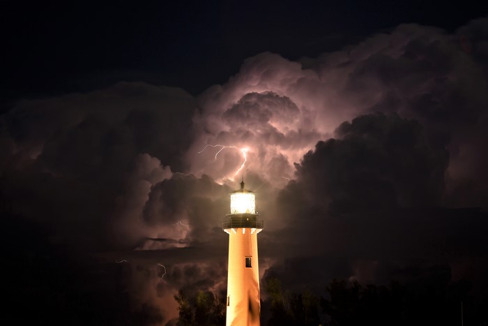 Lighthouse during a thunderstorm with lightning