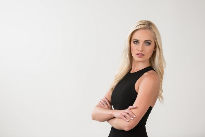 Tomi Lahren Confident Woman with Blonde Hair Black Dress