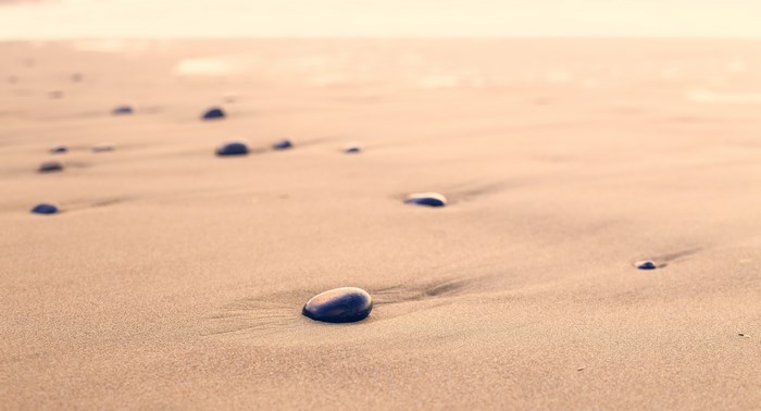 Pebbles on a Sandy Beach