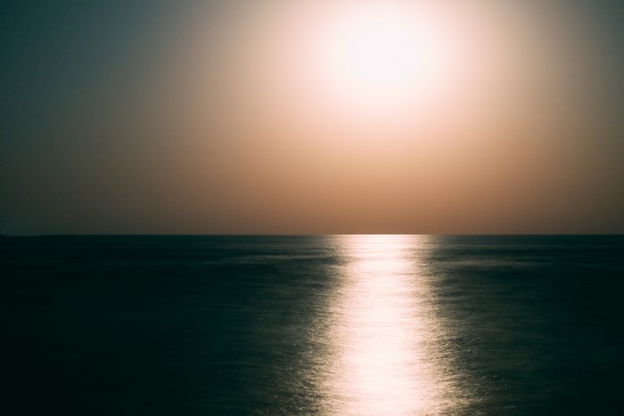 Minimalist ocean reflection at sunrise or sunset