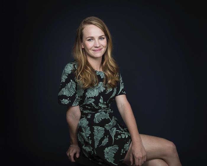Brittany Robertson smiling in a black dress