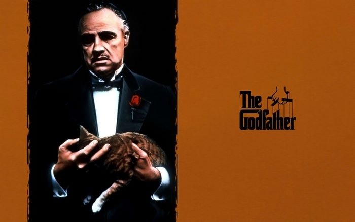 Marlon Brando as Don Corleone holding a cat in The Godfather