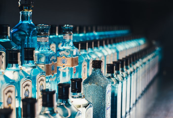 Bombay Sapphire gin bottles displayed in rows
