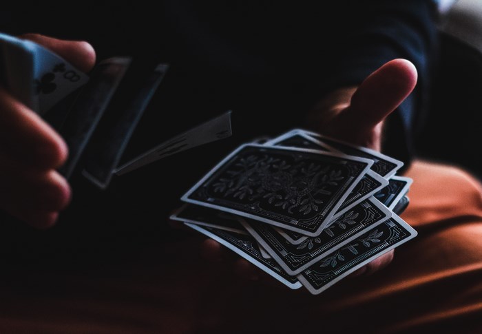 Person shuffling playing cards