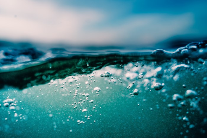 Underwater view of ocean water with bubbles