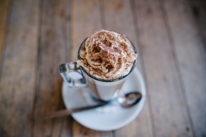 Hot chocolate with whipped cream and cocoa powder