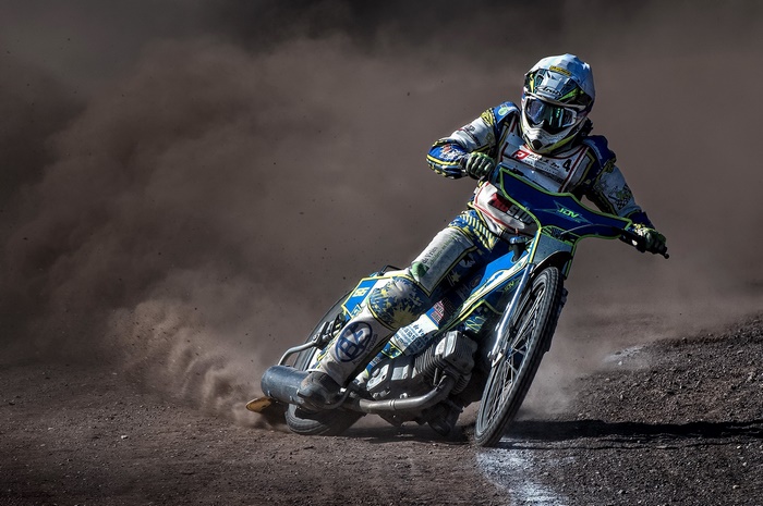 Speedway motorcycle racer in action