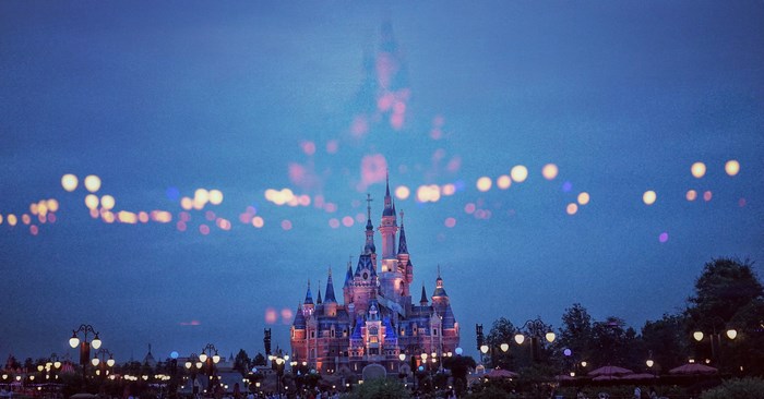Disneyland castle at night with bokeh lights
