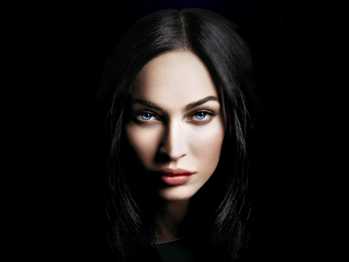 Megan Fox with black hair and blue eyes