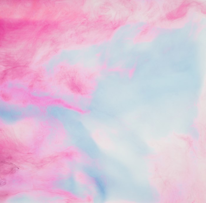 Abstract mixture of pink and blue liquid