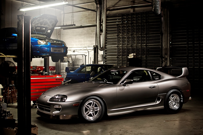 Subaru and Toyota Supra Sports Cars in Garage
