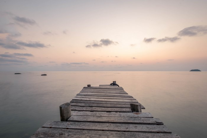 Wooden pier on the water at sunset, Koh Chang, Thailand