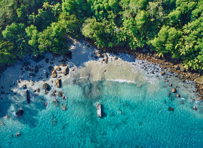 Aerial view of a tropical beach with a boat
