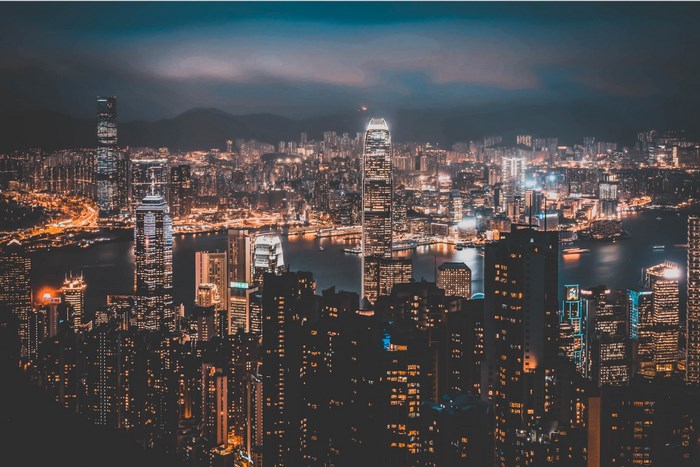 Hong Kong cityscape at night with illuminated skyscrapers