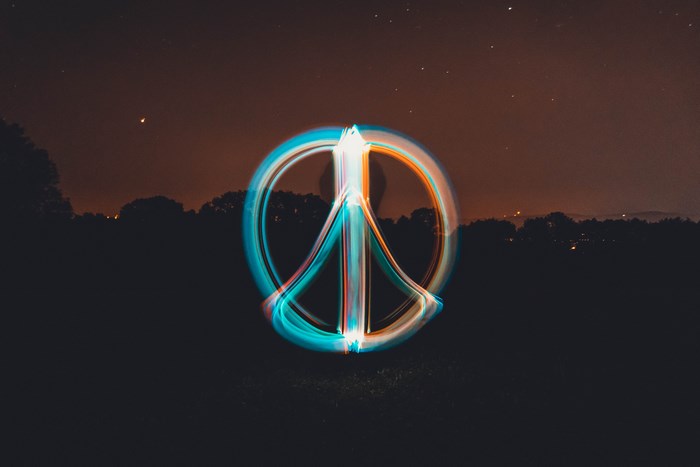Peace sign light painting at night
