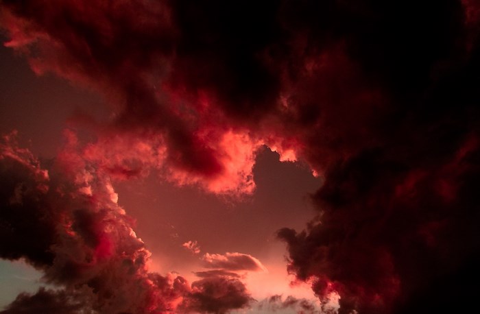 Dark red clouds at sunset or sunrise