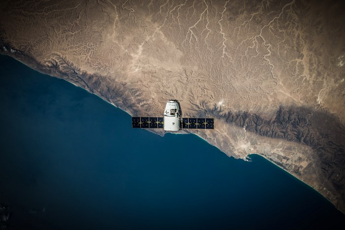 Satellite over a desert coastline from space