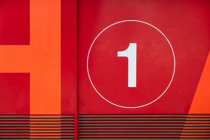 Modern building facade with number 1 sign