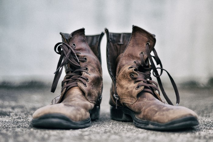 Pair of worn brown leather lace-up boots