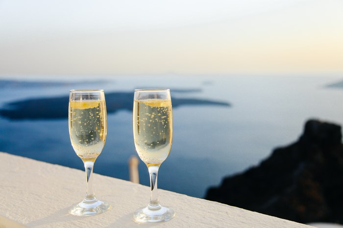 Two glasses of champagne with a sea view