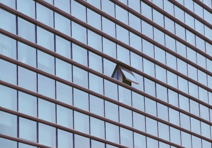Building facade with an open window