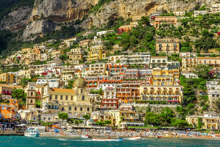 Colorful coastal village built on a steep mountain overlooking the sea