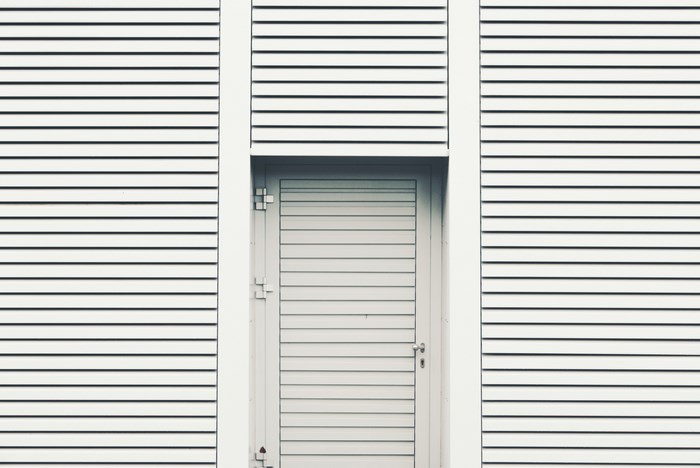 White louvered door on a louvered wall in Cologne, Germany