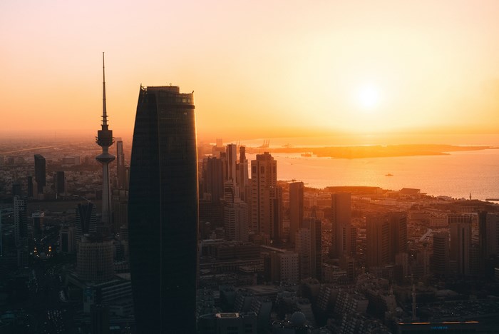 Kuwait Cityscape at Sunset with Skyscrapers and Tower