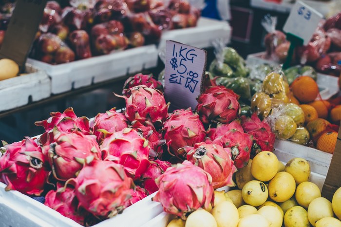 Dragon fruit and lemons at a market stall