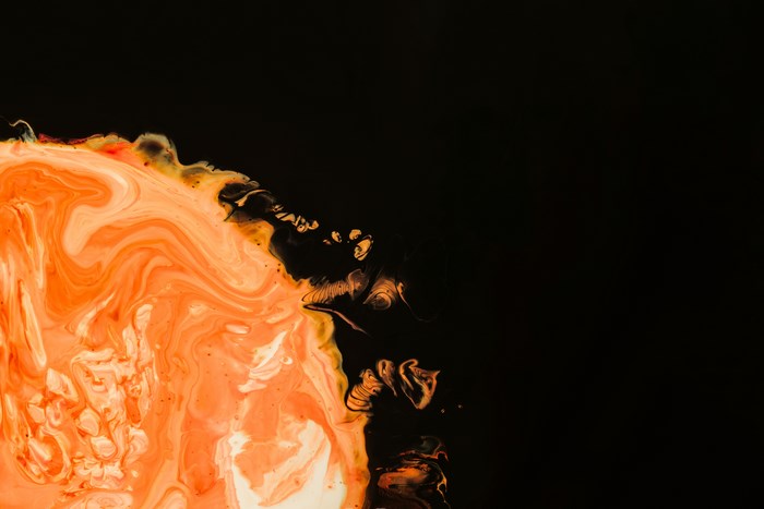 Abstract orange and black fluid art