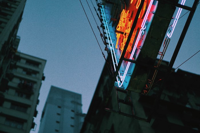 Neon sign in urban city at night