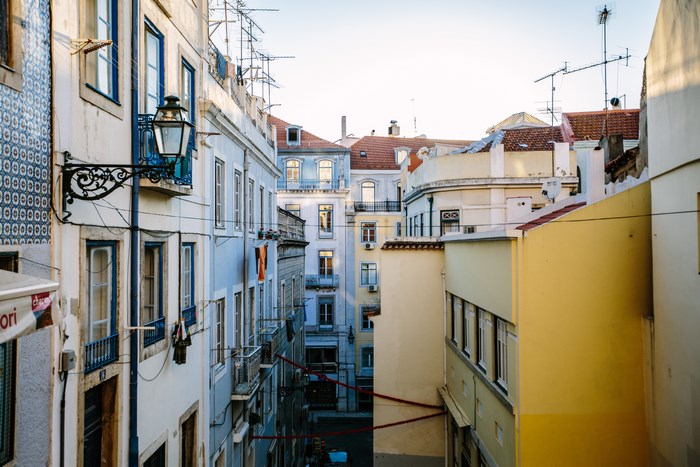 Lisbon street with colorful buildings and balconies