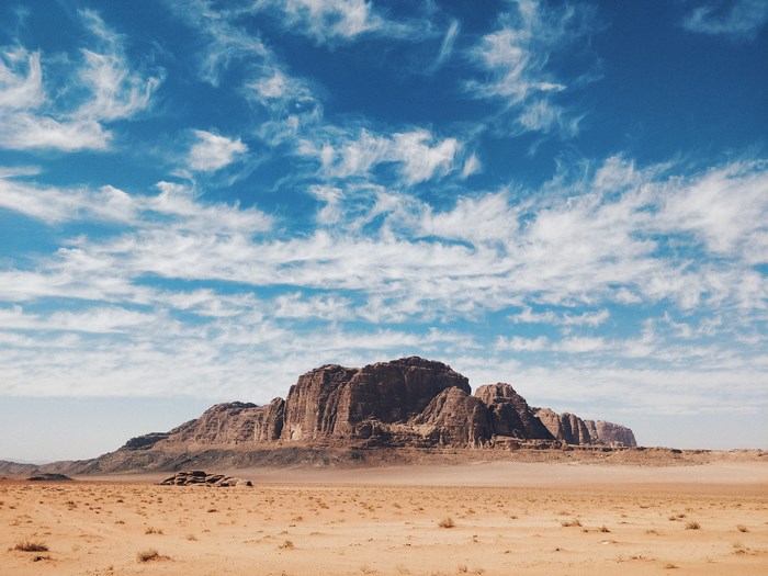 Desert landscape with mountains and clouds