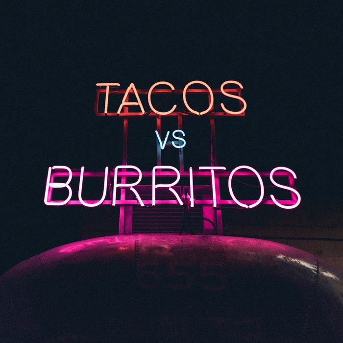 Tacos vs Burritos neon sign at night