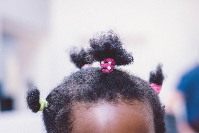 African American Girl with Colorful Afro Pigtails