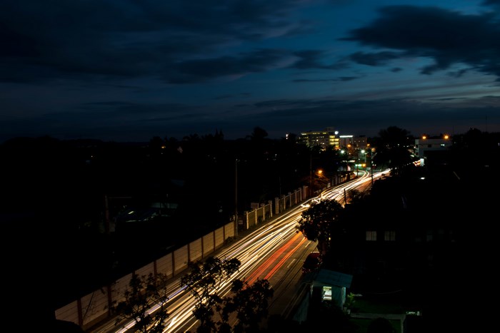 Long exposure of city street at night with light trails