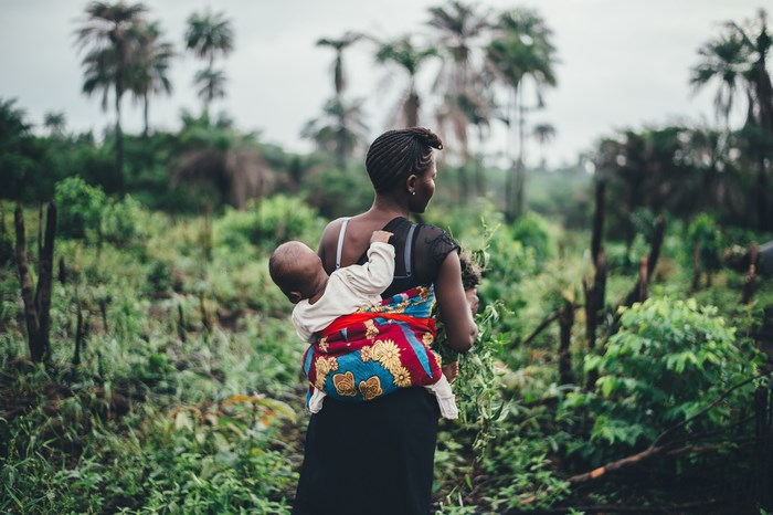 Mother carrying a baby in Sierra Leone